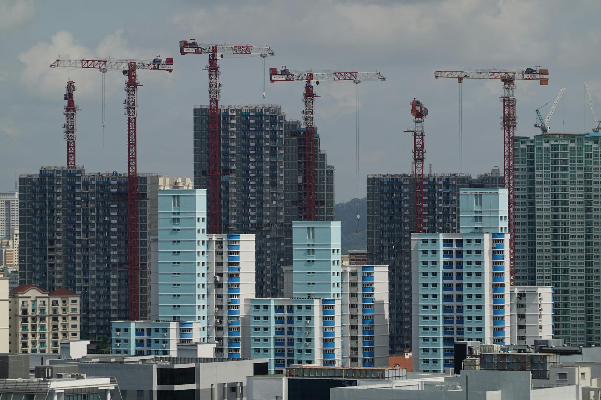 A buyer walking through a Singapore neighbourhood — the new launch shortlist walk